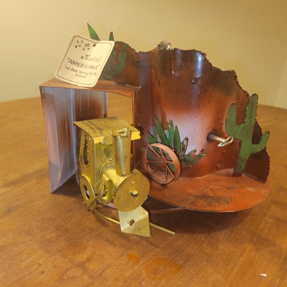 Oxidized Copper Train Moves in Circles - Music Box Works